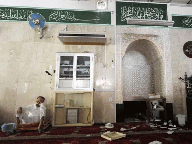 a saudi man reacts following a suicide blast inside a mosque in the saudi town of qatif 400 kms east of riyadh on may 22 2015 photo afp a saudi man reacts following a suicide blast inside a mosque in the saudi town of qatif 400 kms east of riyadh on may 22 2015 photo afp