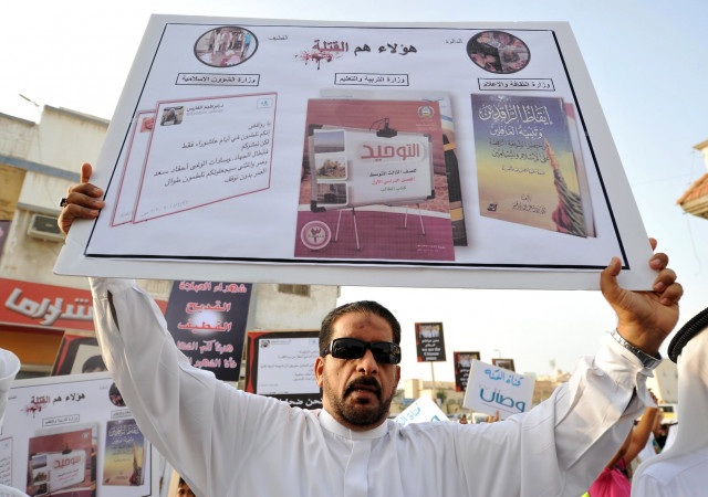 a saudi man holds a placard during a protest outside a mosque in kudeih in the mainly shia saudi gulf coastal town of qatif 400 kms east of riyadh on may 24 2015 photo afp a saudi man holds a placard during a protest outside a mosque in kudeih in the mainly shia saudi gulf coastal town of qatif 400 kms east of riyadh on may 24 2015 photo afp