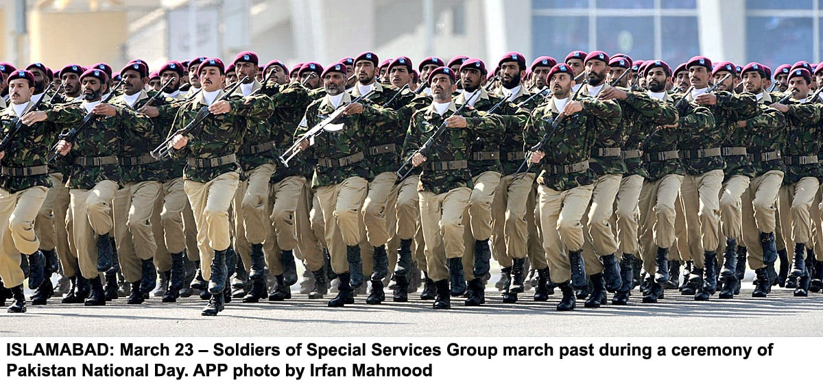 soldiers of special services group march past during a ceremony of pakistan national day photo app