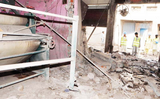 the dry cleaning unit in shambles after the blast photo riaz ahmed express the dry cleaning unit in shambles after the blast photo riaz ahmed express