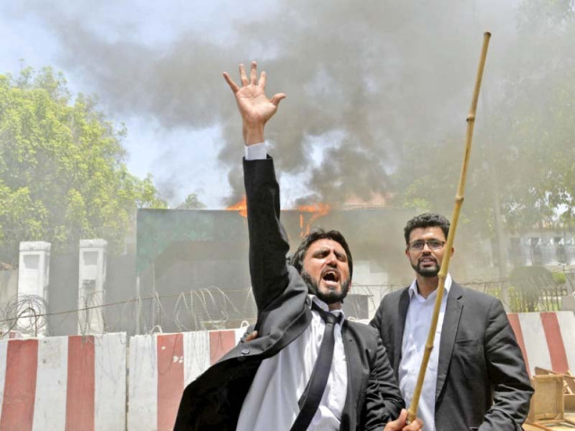 a lawyer in lahore shouts slogans outside the punjab assembly photo afp a lawyer in lahore shouts slogans outside the punjab assembly photo afp