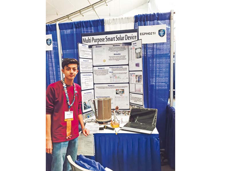 habab idress shows off his solar powered thermostat device at the intel international science and engineering fair in pittsburg photo express