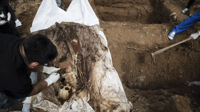 bodies were wrapped in white cloth following muslim tradition and were marked with wooden sticks says minister photo reuters bodies were wrapped in white cloth following muslim tradition and were marked with wooden sticks says minister photo reuters