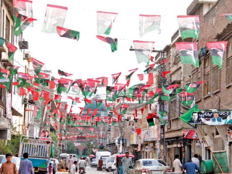 banners and flags in town i photos muhammad iqbal express