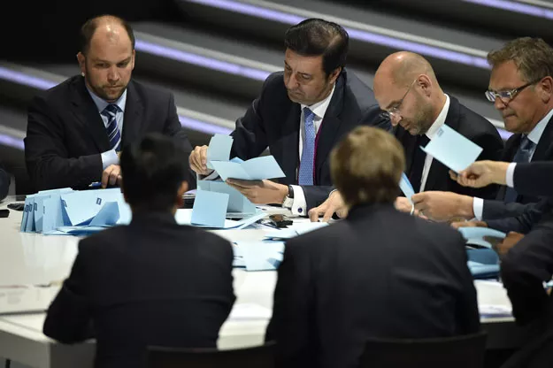 officials sift through ballots as counting got underway following the vote to decide on the fifa presidency in zurich on may 29 2015 photo afp officials sift through ballots as counting got underway following the vote to decide on the fifa presidency in zurich on may 29 2015 photo afp