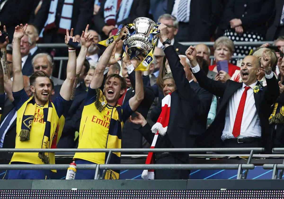 arsenal 039 s french manager arsene wenger r and arsenal 039 s spanish defender nacho monreal hold up the trophy after winning the fa cup final football match between aston villa and arsenal at wembley stadium in london on may 30 2015 photo afp arsenal 039 s french manager arsene wenger r and arsenal 039 s spanish defender nacho monreal hold up the trophy after winning the fa cup final football match between aston villa and arsenal at wembley stadium in london on may 30 2015 photo afp