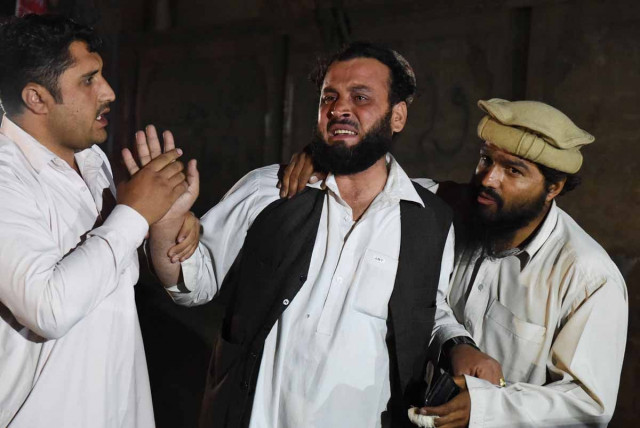 a man mourns the death of a relative outside the hospital in quetta on may 30 2015 photo afp a man mourns the death of a relative outside the hospital in quetta on may 30 2015 photo afp