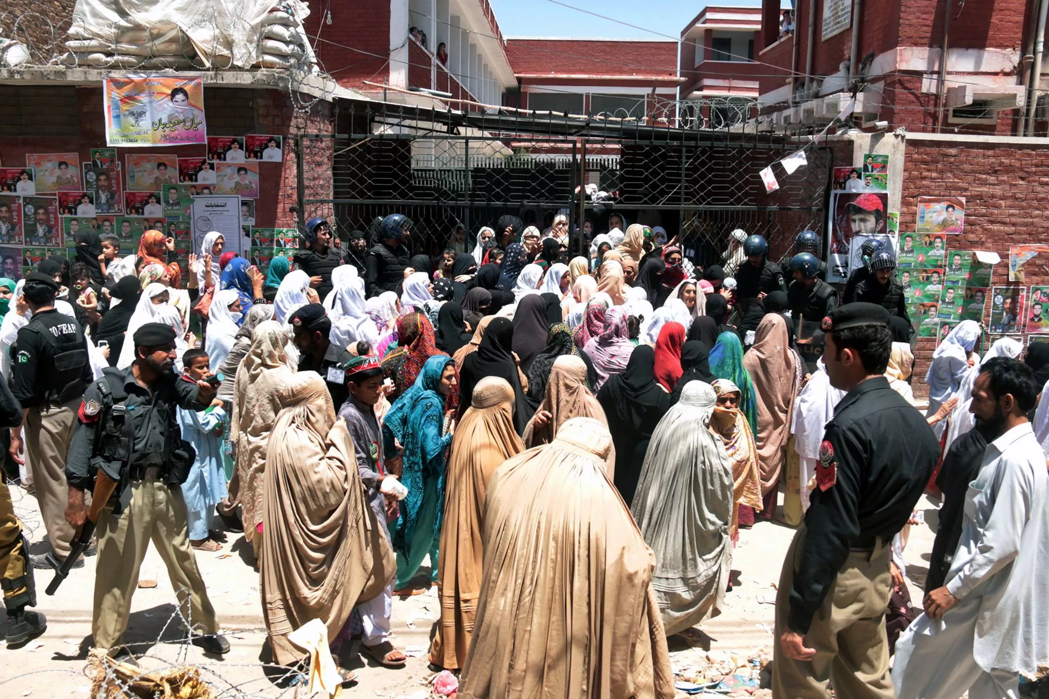 voters wait to be allowed into the polling station established at begum shahabuddin school in the walled city photo muhammad iqbal express voters wait to be allowed into the polling station established at begum shahabuddin school in the walled city photo muhammad iqbal express