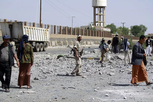huthi shia militants inspect damage following an air strike by the saudi led coalition on may 31 2015 in al thawra sport city located north of the capital sanaa photo afp huthi shia militants inspect damage following an air strike by the saudi led coalition on may 31 2015 in al thawra sport city located north of the capital sanaa photo afp