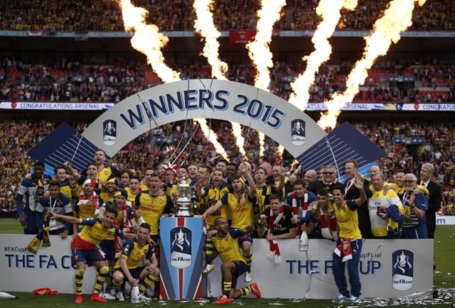 historymakers arsenal retained the fa cup in majestic style as their 4 0 demolition of aston villa in saturday 039 s final made history for the gunners and their manager arsene wenger photo afp