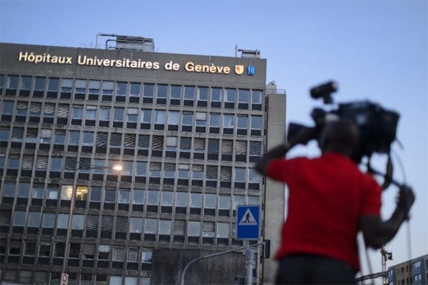 a cameraman films the geneva university hospital where us secretary of state john kerry receives treatment photo afp