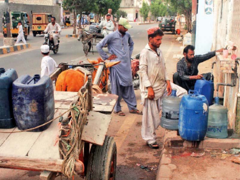 citizens fill water containers at a pumping station in baldia almost all the areas in karachi are facing an acute shortage of water since the last few weeks photo online