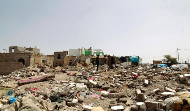 yemenis walk amidst the rubble of houses destroyed by saudi led air strike on a residential area in sanaa on may 18 2015 photo afp yemenis walk amidst the rubble of houses destroyed by saudi led air strike on a residential area in sanaa on may 18 2015 photo afp