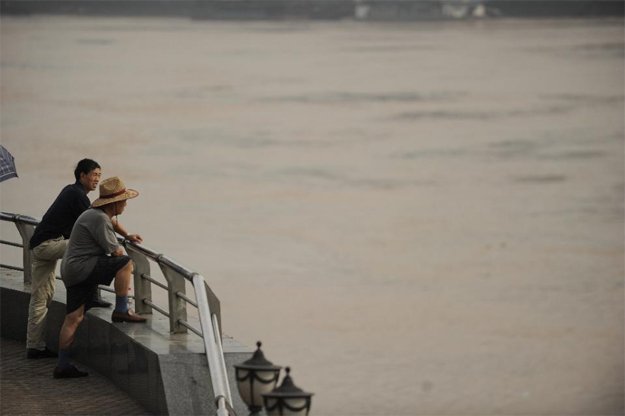 people look out onto the yangtze river in chongqing photo afp