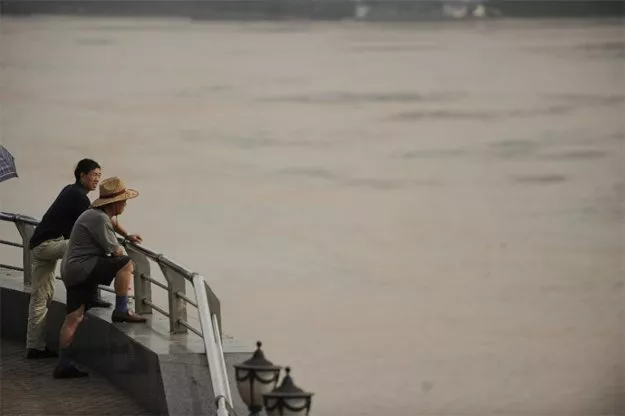 people look out onto the yangtze river in chongqing photo afp people look out onto the yangtze river in chongqing photo afp