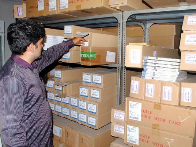 a raiding party member inspects the seized goods photo inp a raiding party member inspects the seized goods photo inp