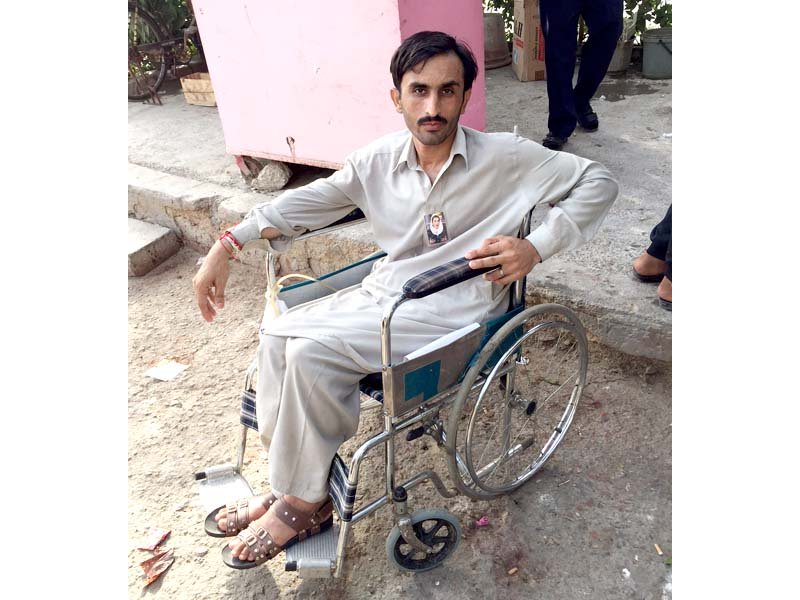 irshad hussain a young ppp activist was injured in the bomb attack on benazir bhutto s convoy at karsaz the wheelchair bound man has threatened to self immolate if bilawal bhutto zardari does not take care of his medical expenses photo express