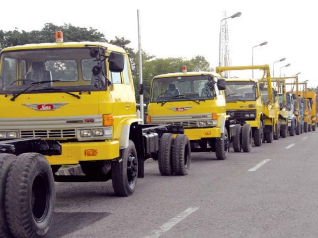recently refurbished garbage trucks belonging to the capital development authority are parked alongside a road in islamabad the trucks will be operational from next week photo inp recently refurbished garbage trucks belonging to the capital development authority are parked alongside a road in islamabad the trucks will be operational from next week photo inp