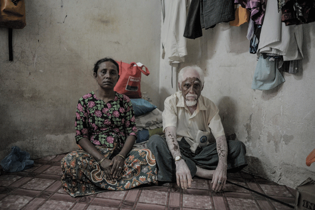 sayat ahmad shobi r 61 and his wife khotijah soyot 47 ethnic rohingya refugees from myanmar living in malaysia posing inside a house in ampang in the suburbs of kuala lumpur malaysia is a beacon for ethnic rohingya fleeing oppression and a precarious existence in myanmar but countless migrants like mohammed ismail are still searching for the promised land years after arriving photo afp