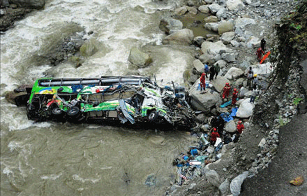 a brake defect causes driver to lose control sending the bus crashing 200 metres down into a river photo file