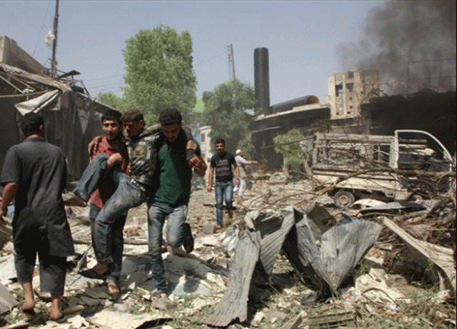 syrian men help an injured person after a reported barrel bomb attack by syrian government forces hit an open market in the northern city of aleppo on june 3 2015 killing and injuring people photo afp syrian men help an injured person after a reported barrel bomb attack by syrian government forces hit an open market in the northern city of aleppo on june 3 2015 killing and injuring people photo afp