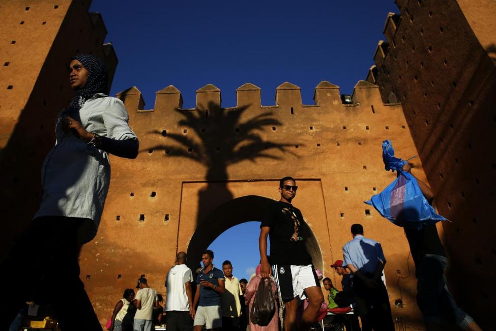 people walk through bab el had gates of rabat 039 s medina september 21 2014 photo reuters