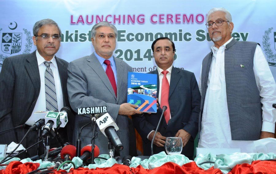 finance minister ishaq dar holds a copy of economic survey 2014 15 in islamabad on june 4 2015 photo pid