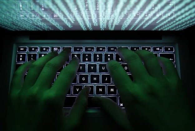 a man types on a computer keyboard in warsaw photo reuters