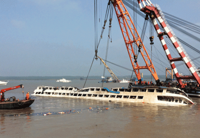 cranes on friday slowly raise the sunken vessel with exhausted relatives preparing themselves for further agony photo afp cranes on friday slowly raise the sunken vessel with exhausted relatives preparing themselves for further agony photo afp