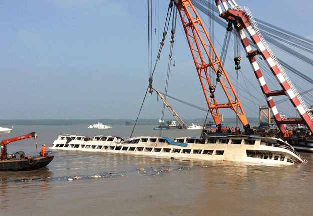 cranes on friday slowly raise the sunken vessel with exhausted relatives preparing themselves for further agony photo afp