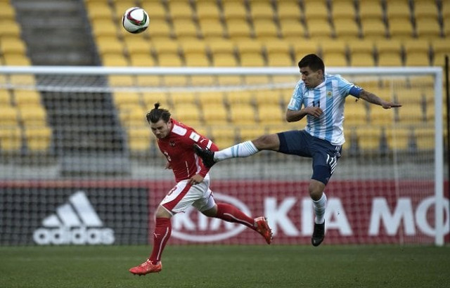 angel correa of argentina r kicks the ball next to daniel rosenbichler of austria during their fifa under 20 world cup football match in wellington on june 5 2015 afp photo marty melville angel correa of argentina r kicks the ball next to daniel rosenbichler of austria during their fifa under 20 world cup football match in wellington on june 5 2015 afp photo marty melville