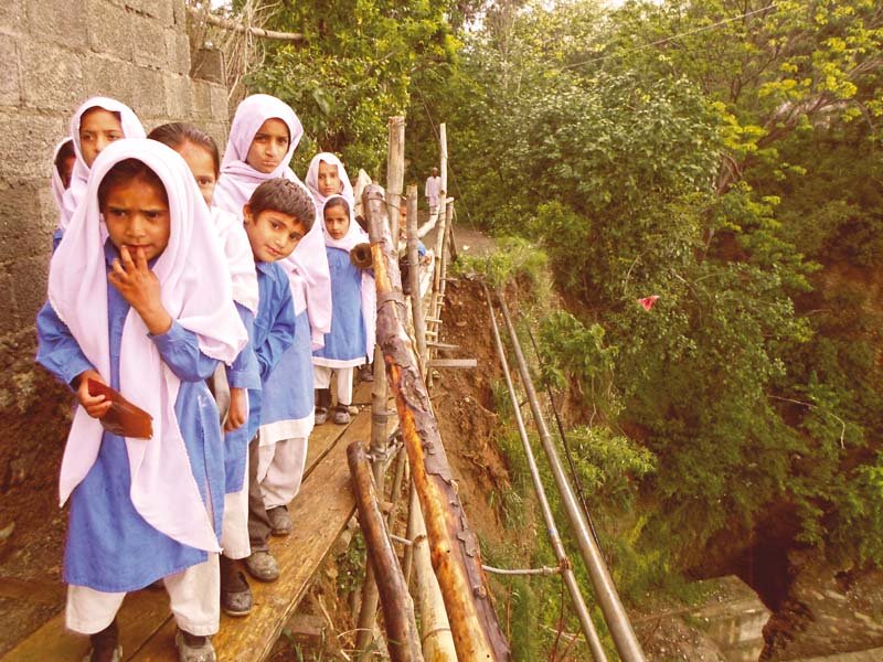 with no alternative to choose schoolchildren walk the 4ft wide makeshift passage every day photo courtesy mustafa khan