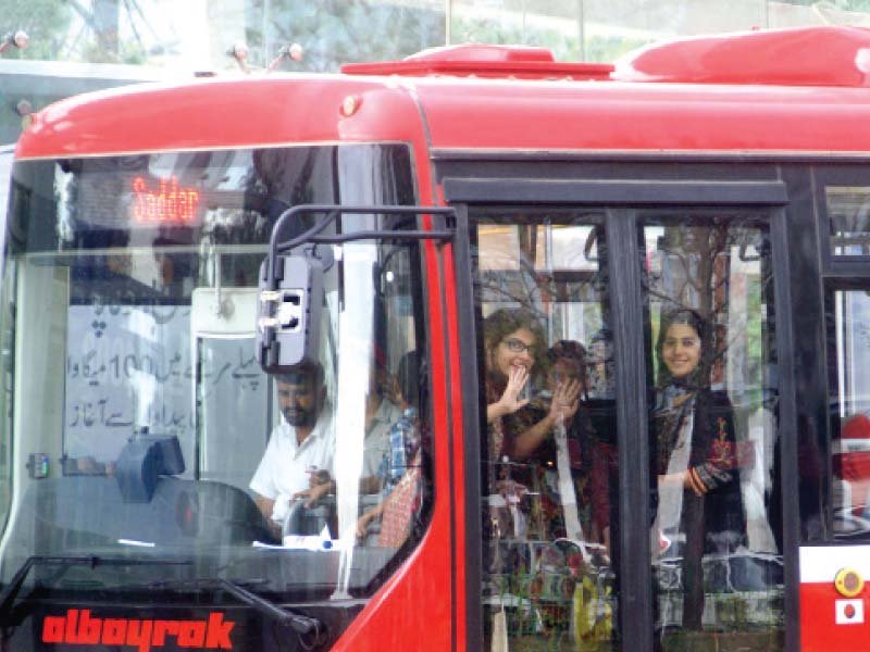 students taking their first ride on the metro bus in islamabad photo inp