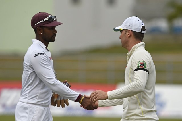 west indies captain denesh ramdin l shakes hands with australian captain michael clarke at the end of the first test match between australia and the west indies june 5 2015 at windsor park stadium in roseau dominica australia defeated the west indies by nine wickets after tea with finals scores west indies 148 and 216 australia 318 and 47 for one photo afp