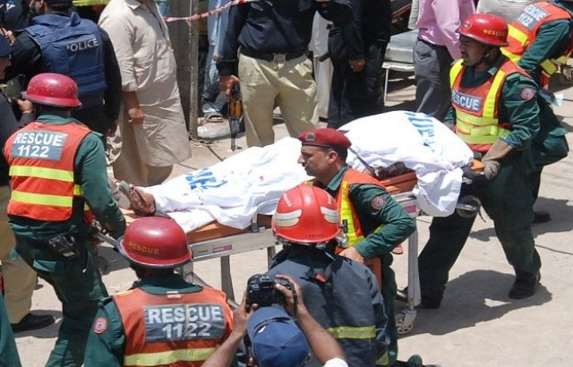 body of the suspected terrorist being shifted photo express body of the suspected terrorist being shifted photo express