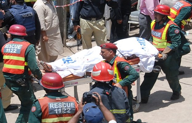 body of the suspected terrorist being shifted photo express