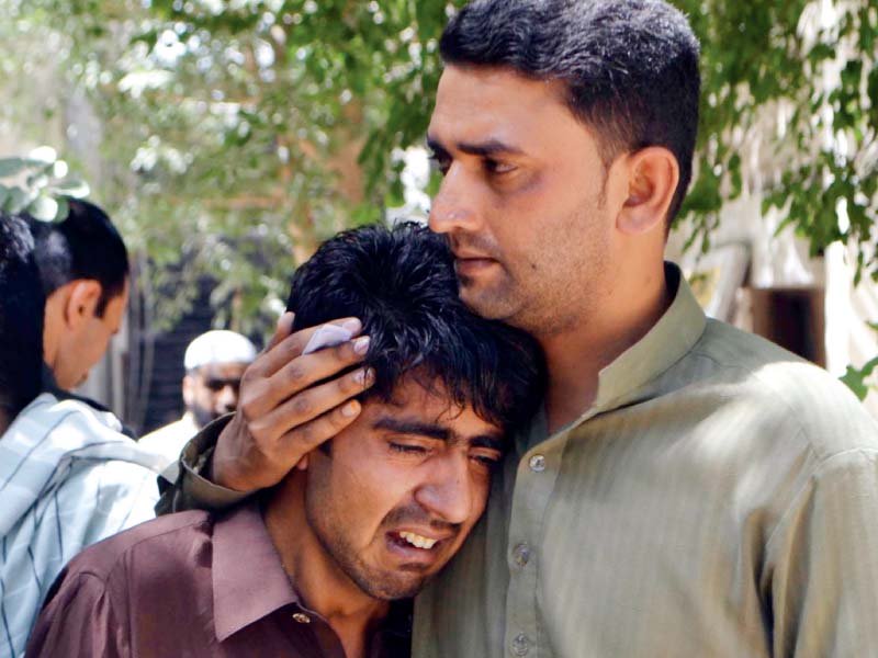 relatives of a slain policeman mourn his death photo inp