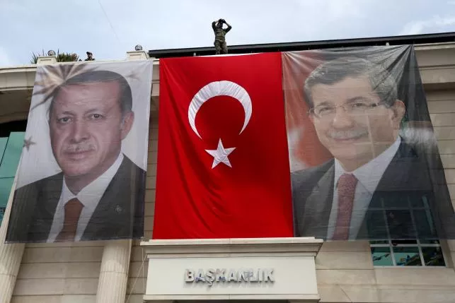 a special forces police officer takes security measures as he stands on top of a building where the portraits of turkey 039 s president tayyip erdogan l prime minister ahmet davutoglu and a turkish flag are displayed in istanbul photo reuters a special forces police officer takes security measures as he stands on top of a building where the portraits of turkey 039 s president tayyip erdogan l prime minister ahmet davutoglu and a turkish flag are displayed in istanbul photo reuters