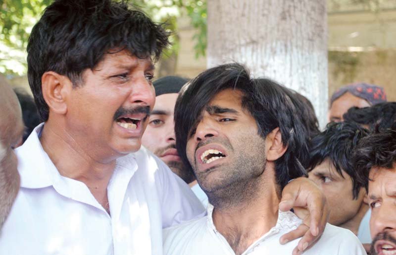 relatives of the victims up protesters blocked the islamabad expressway for several hours photos nni waseem nazir