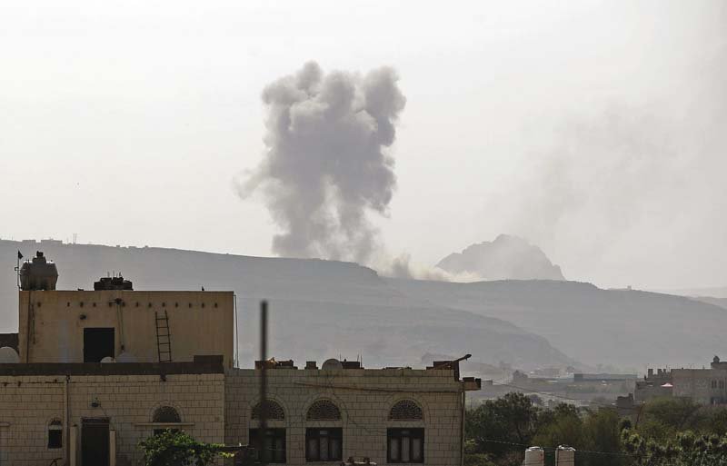 smoke billows following an air strike by the saudi led coalition on an army arms depot now under houthi rebel control photo afp