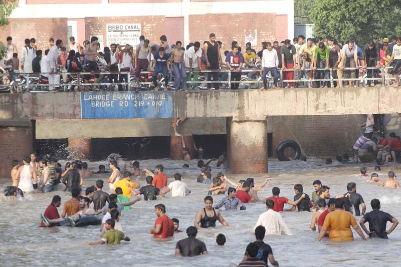 a view of the canal at jallo mor on sunday photo shafiq malik express