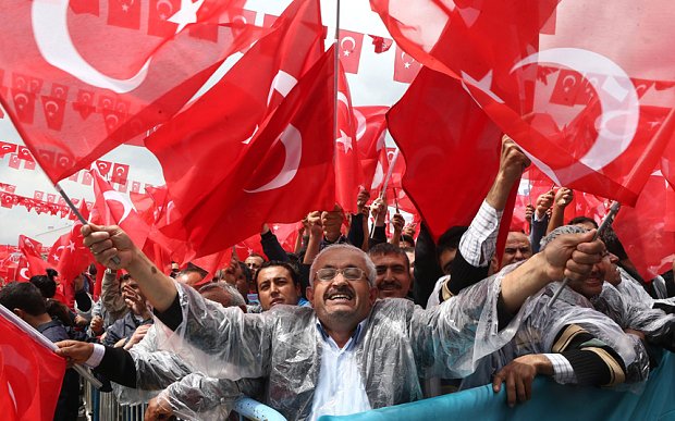 supporters cheer turkey 039 s president recep tayyip erdogan as he addresses an election rally in golbasi photo afp