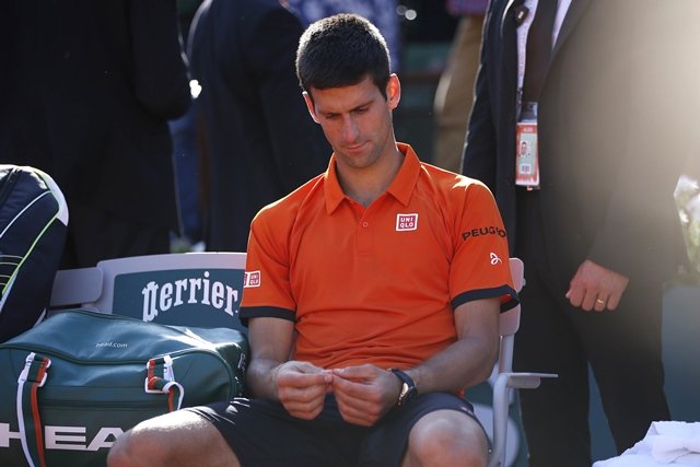 serbia 039 s novak djokovic reacts after his match against switzerland 039 s stanislas wawrinka at the end of their men 039 s final match of the roland garros 2015 french tennis open in paris on june 7 2015 photo afp