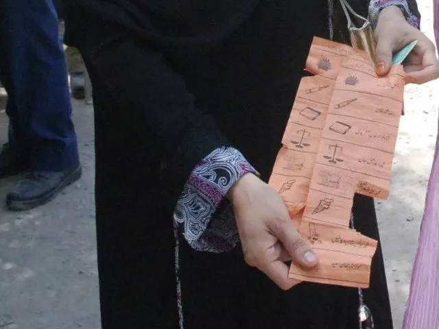 a voter in charsadda shows a torn ballot paper photo sameer raziq express a voter in charsadda shows a torn ballot paper photo sameer raziq express