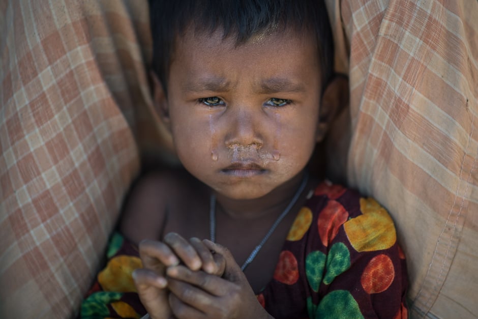 A Rohingya Muslim refugee child cries as she sits in the Kutupalong refugee camp in Cox's Bazar. PHOTO: AFP