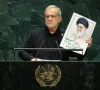 iranian president masoud pezeshkian holds up an image of late supreme leader ali khamenei at the un general assembly rostrum on september 23 2026 reuters