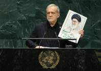 iranian president masoud pezeshkian holds up an image of late supreme leader ali khamenei at the un general assembly rostrum on september 23 2026 reuters