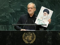 iranian president masoud pezeshkian holds up an image of late supreme leader ali khamenei at the un general assembly rostrum on september 23 2026 reuters
