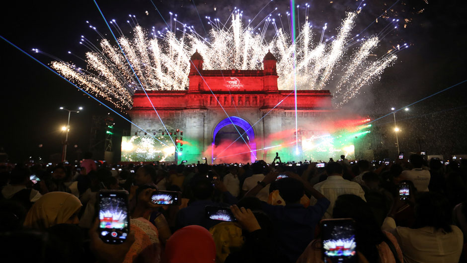 People record fireworks on mobile phones at the Gateway of India monument on New Year's Day in Mumbai, India, January, 1, 2020. PHOTO: REUTERS