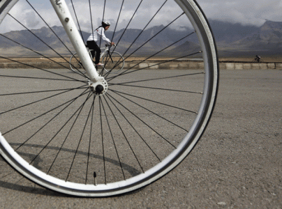 afghan woman puts the pedal to the metal for women s rights